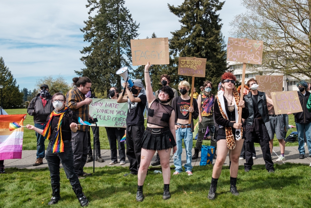 A group of trans rights supporters make some noise in response to an anti-trans hate rally, April 6.
