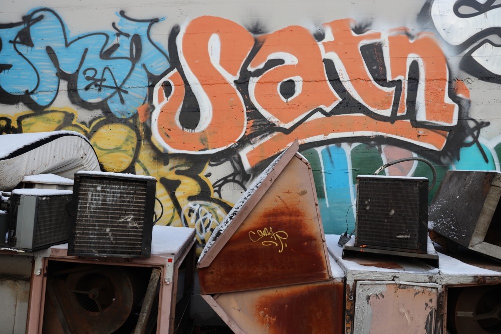 Wall on which orange tag reading, "Satn" figures prominently