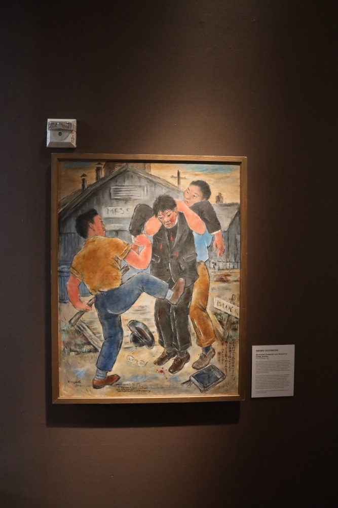 Painting showing three Asian men in work clothes, one being held up by the arms by another while a third one kicks him in the leg